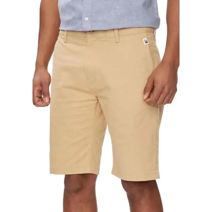 Khaki-colored knee-length Tommy Hilfiger shorts with belt loops and waistband logo