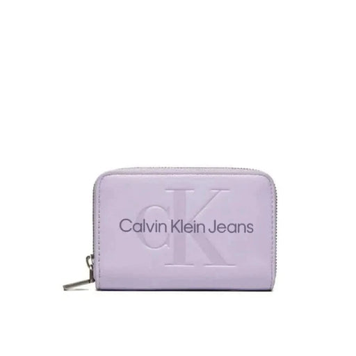 Lavender Calvin Klein Jeans wallet with embossed logo and zipper closure for women