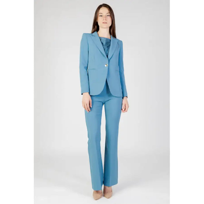 Light blue Rinascimento women pantsuit featuring single-button blazer and flared trousers