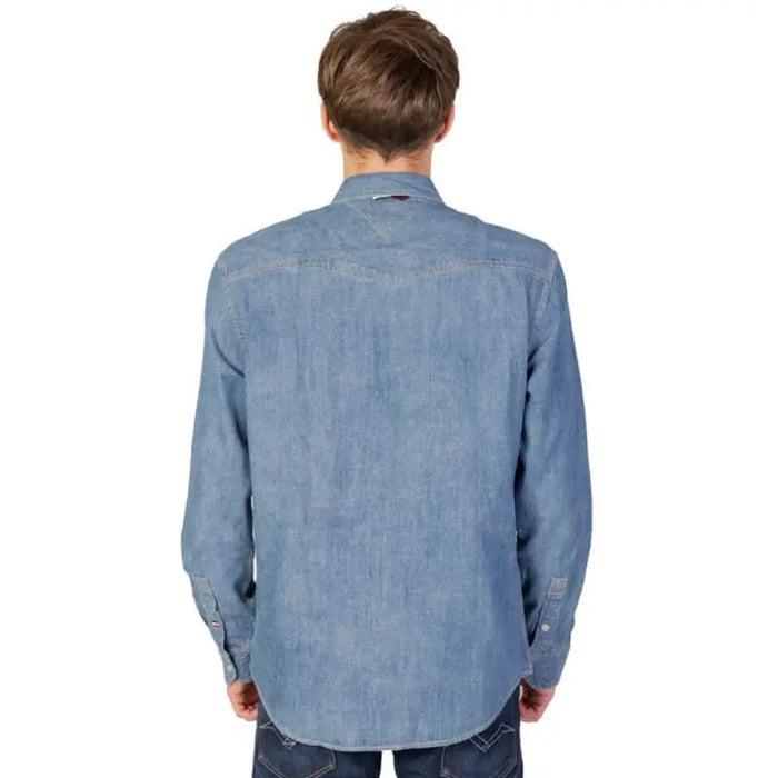 Light blue denim shirt by Tommy Hilfiger viewed from the back on a male model