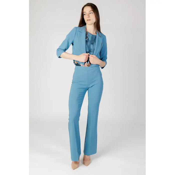 Light blue Rinascimento women’s pantsuit featuring a cropped blazer and flared trousers