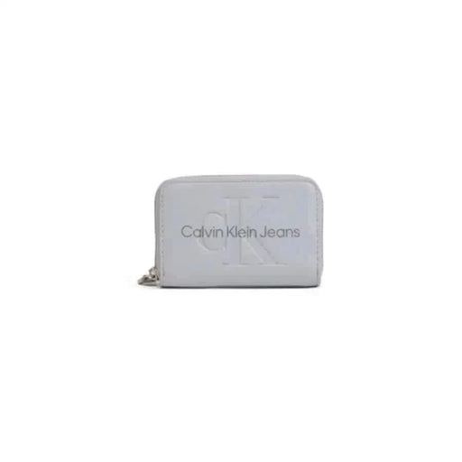 Light gray Calvin Klein Jeans wallet with embossed logo and zipper closure