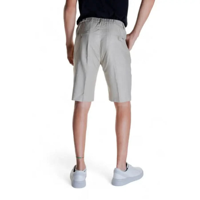 Light gray knee-length Antony Morato Men Shorts modeled by a person