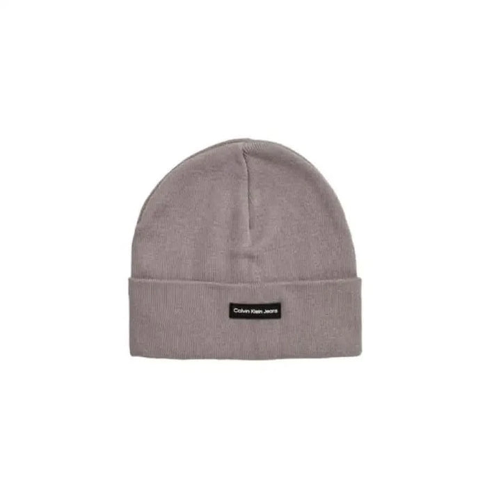 Light gray knit beanie featuring a black label patch from Calvin Klein Men Cap