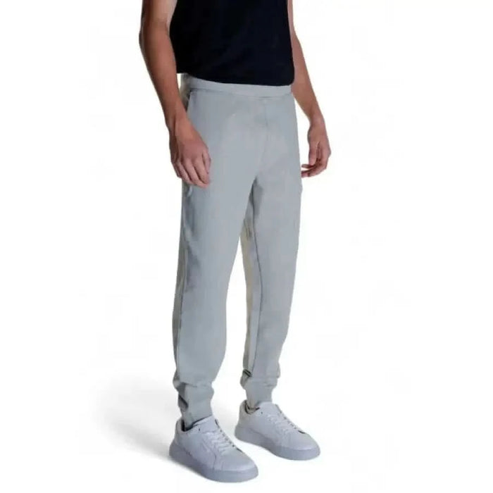 Calvin Klein light gray sweatpants with white sneakers, men’s trousers fashion