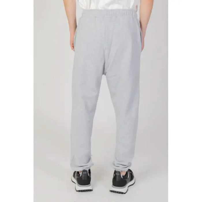 Light gray sweatpants paired with black sneakers Underclub Men Trousers stylish casual attire