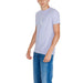 Light gray Calvin Klein Jeans t-shirt with subtle logo paired with blue jeans