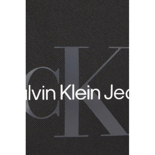 Calvin Klein Jeans logo on dark fabric background for Men Bag product