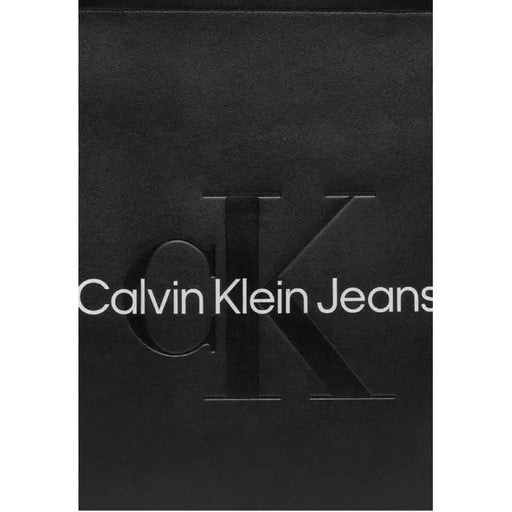 Calvin Klein Jeans logo in white on black, featured on Calvin Klein Women Bag