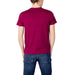 Back view of a magenta U.S. Polo Assn. short-sleeved t-shirt with blue jeans