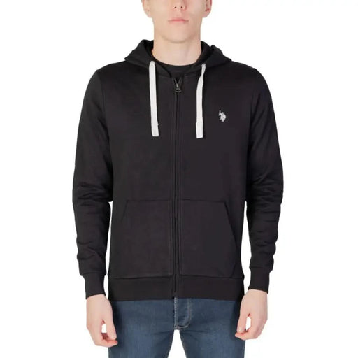 Man in U.S. Polo Assn. black hoodie embodying urban style clothing