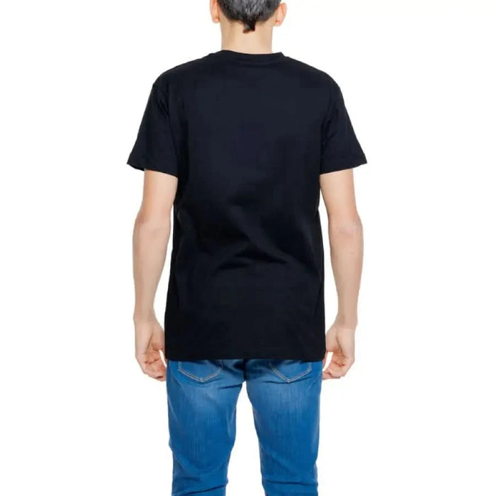 Man in black Hydra Clothing T-shirt and jeans, perfect urban apparel