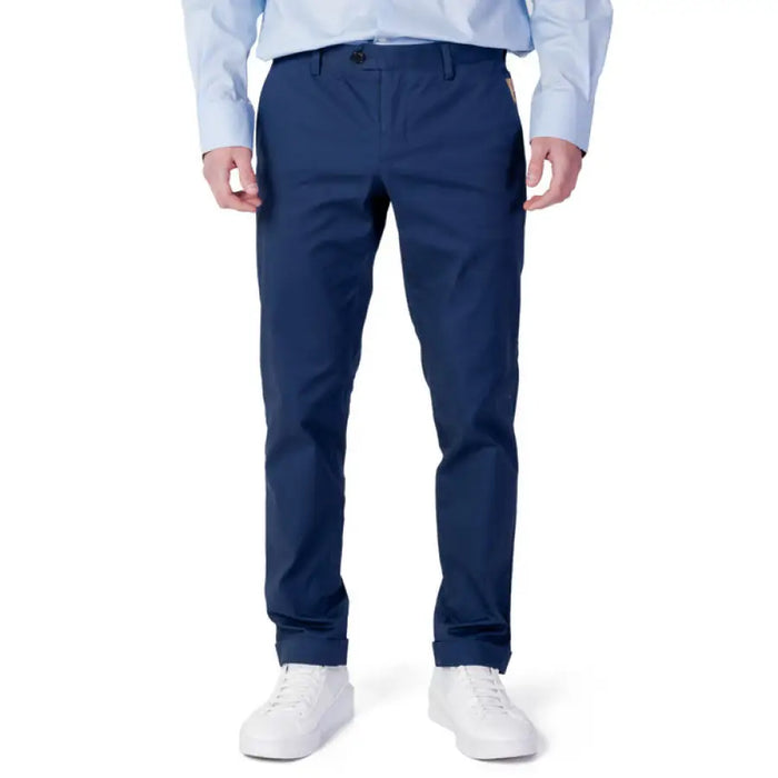 Man wearing blue shirt and Alviero Martini Prima Classe trousers for stylish menswear