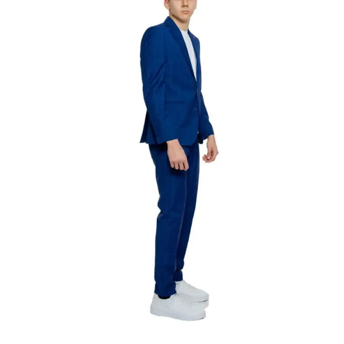 Man in blue suit with white shoes, showcasing Mulish - Mulish Men Suit