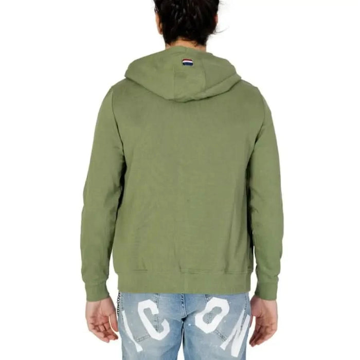 Man in U.S. Polo Assn. green hoodie, men sweatshirts, apparel accessories