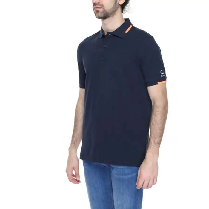 Man in Suns Men Polo, navy with orange trim, embodying urban city style fashion