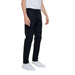 A man in a white shirt and black Antony Morato Men Trousers, perfect for an urban look