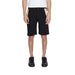 Man in white t-shirt and Alviero Martini Prima Classe black shorts