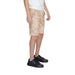 Man wearing Alviero Martini Prima Classe white T-shirt and shorts, stylish summer fashion