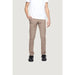 Man in white t-shirt and khaki trousers from Alviero Martini Prima Classe collection