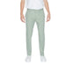 Man in white t-shirt, green Antony Morato trousers - Urban style