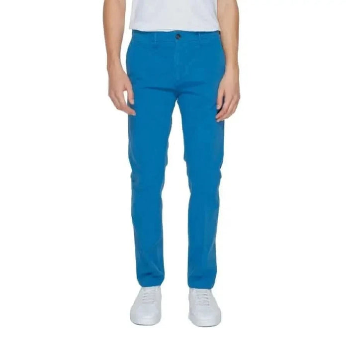 Urban style: Man in white t-shirt and blue Borghese Men Trousers