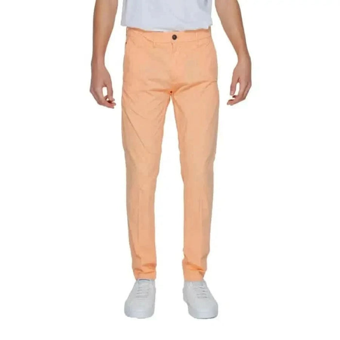 Urban style clothing: Man in white t-shirt and orange Borghese Men Trousers