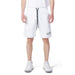 Man in Icon urban style clothing, showcasing white T-shirt and Icon Men Shorts in city