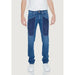 Man in white T-shirt and blue Jeckerson Men Jeans, urban city fashion style