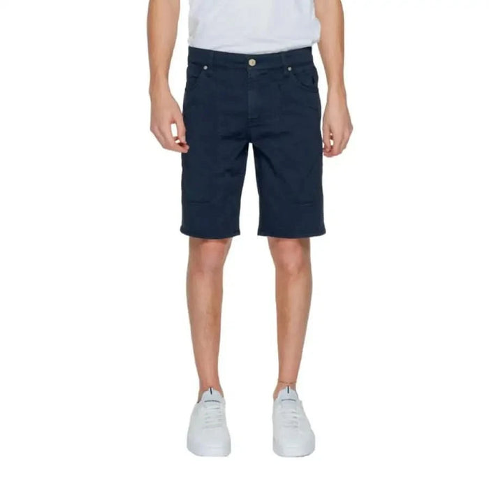 Man wearing Jeckerson Men Shorts with a white T-shirt and black shorts