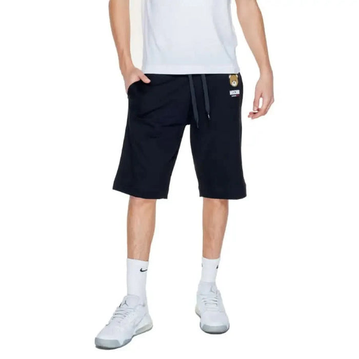 Man wearing Moschino Underwear: white t-shirt and black shorts for men