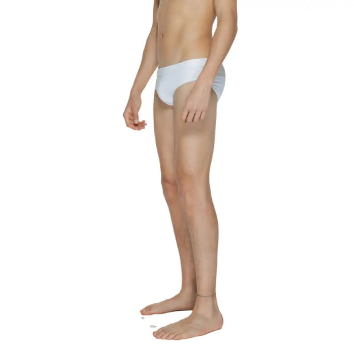 Man’s lower body in white Calvin Klein underwear briefs from Calvin Klein Men Swimwear