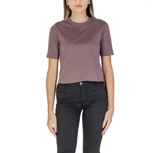 Mauve short-sleeved crew neck t-shirt with black jeans from Calvin Klein Sport Women