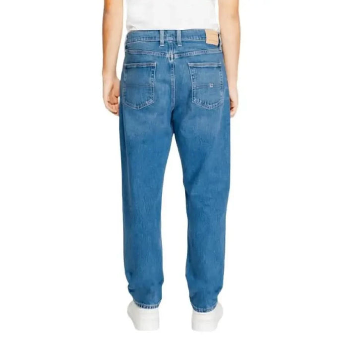 Medium-wash straight-leg denim jeans displayed from the back by Tommy Hilfiger