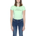 Mint green Armani Exchange Women’s T-Shirt paired with blue jeans, stylish casual wear