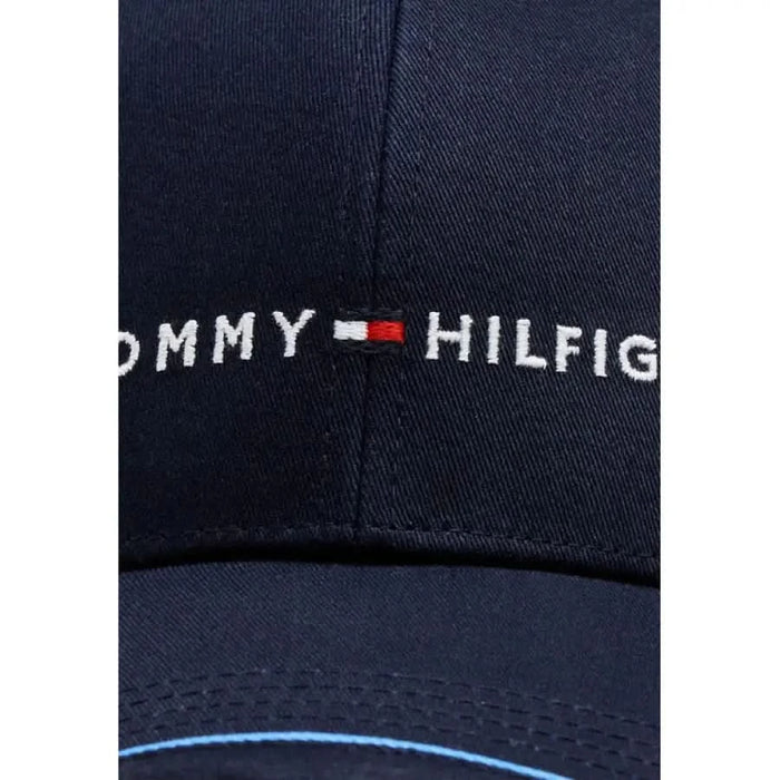 Navy blue Tommy Hilfiger men cap with white embroidered logo displayed