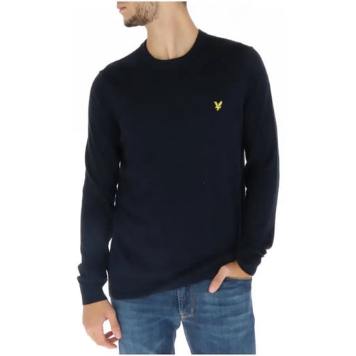 Navy blue crew neck sweater with yellow logo emblem from Lyle & Scott Men Knitwear