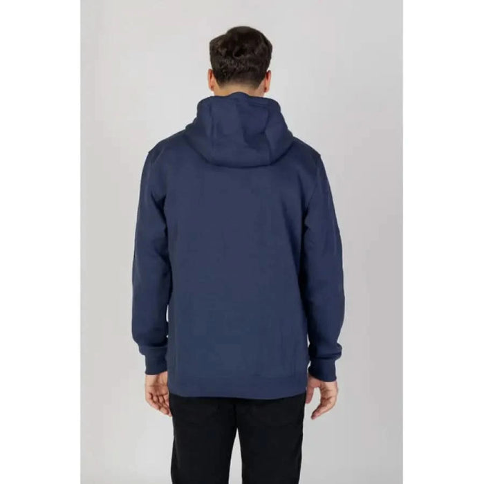 Navy blue hooded sweatshirt modeled by a person, Tommy Hilfiger Jeans Men Sweatshirts