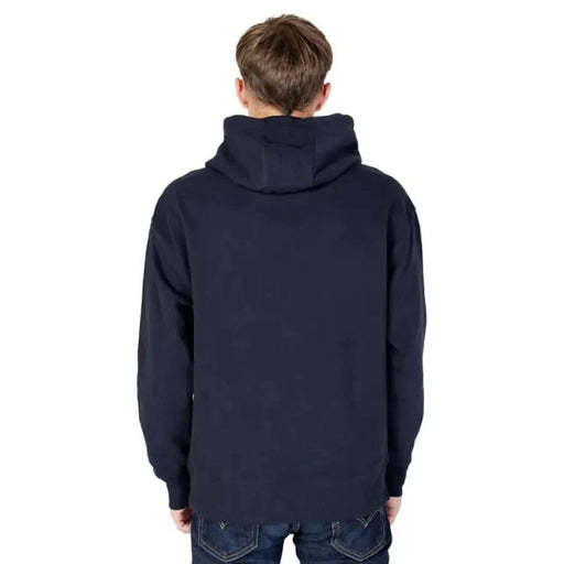 Navy blue hooded sweatshirt on person, back view - Tommy Hilfiger Jeans Men Sweatshirts