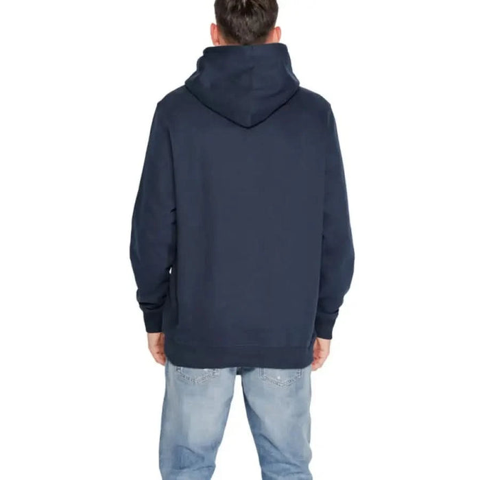 Tommy Hilfiger Men Navy Blue Hooded Sweatshirt worn by person facing away