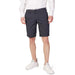 Armani Exchange Men Shorts Navy Blue Patterned with Small White Dots Worn by Person in White Shirt