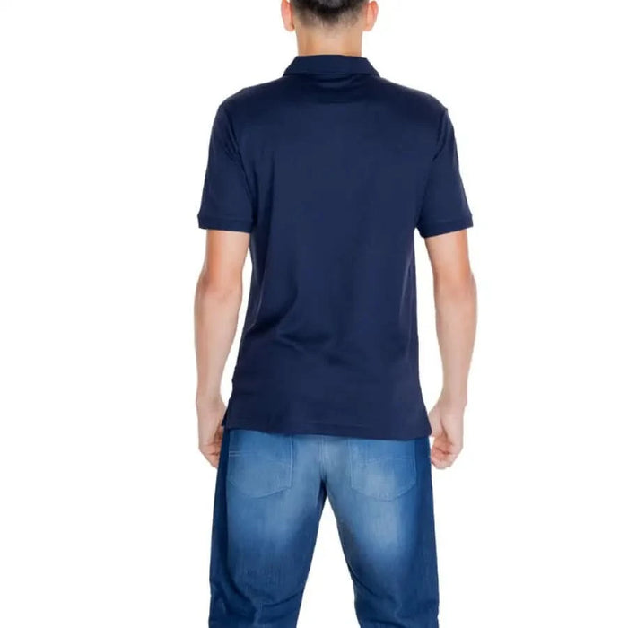 Navy blue Calvin Klein men polo shirt worn by a person seen from behind