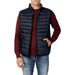 Navy blue quilted puffer vest over a burgundy sweater from U.S. Polo Assn. Men Jacket