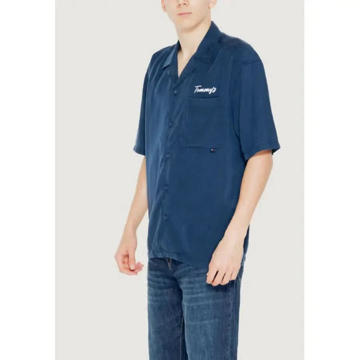 Navy blue short-sleeved button-up shirt with Tommy’s embroidered on chest pocket in Tommy Hilfiger Jeans Men Shirt