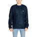 Navy blue Tommy Hilfiger men’s sweater featuring a small logo patch on the chest