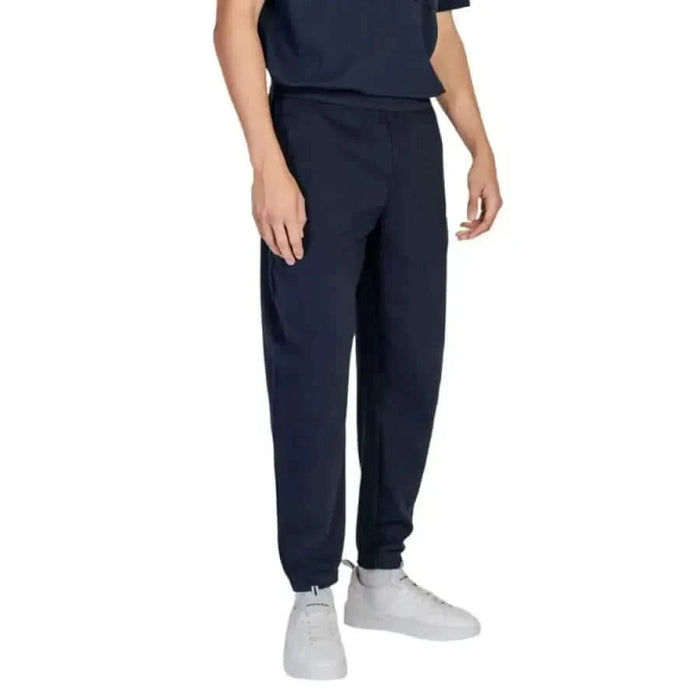 Navy blue Armani Exchange men joggers with elastic cuffs at ankles for stylish comfort