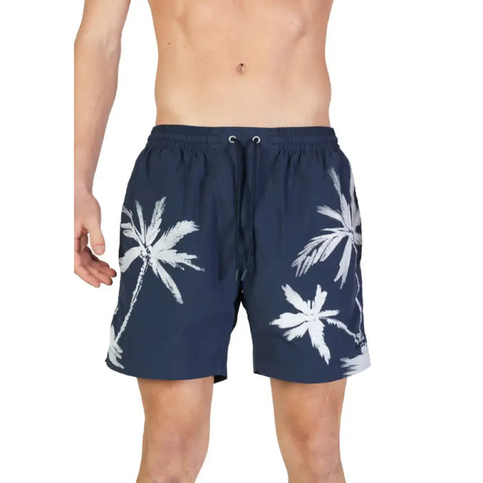 Navy blue swim shorts with white palm tree prints from Boss Men’s Blue Printed Swimwear