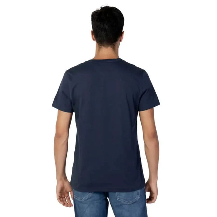 Navy blue t-shirt in Tommy Hilfiger Jeans collection, back view on a male model