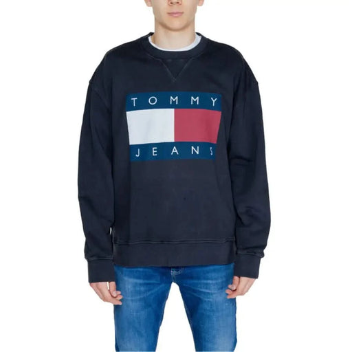 Navy blue Tommy Jeans sweatshirt featuring logo, part of Tommy Hilfiger Men Knitwear