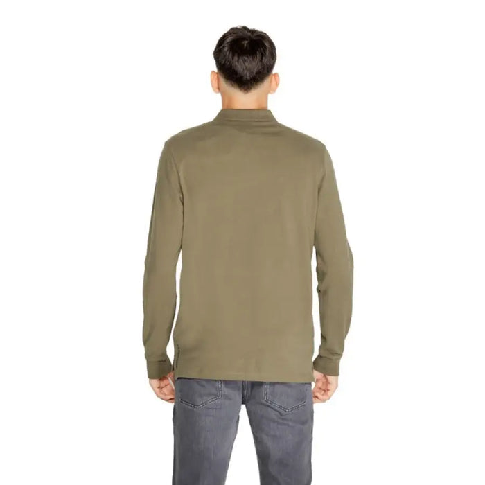 Olive green long-sleeved mock turtleneck shirt paired with gray jeans from US Polo Assn